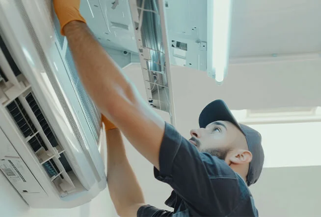 Air conditioner servicing and inspection by technician