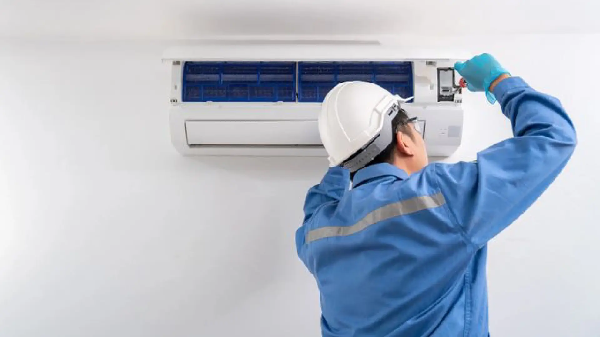 Emergency AC repair service technician at work